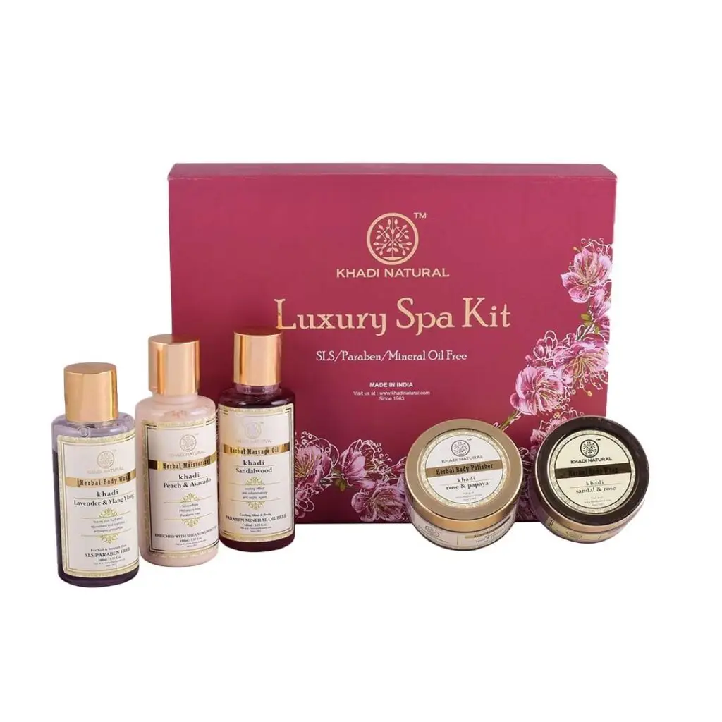 Luxury spa kit by Khadi Natural with various skincare products on a white background.