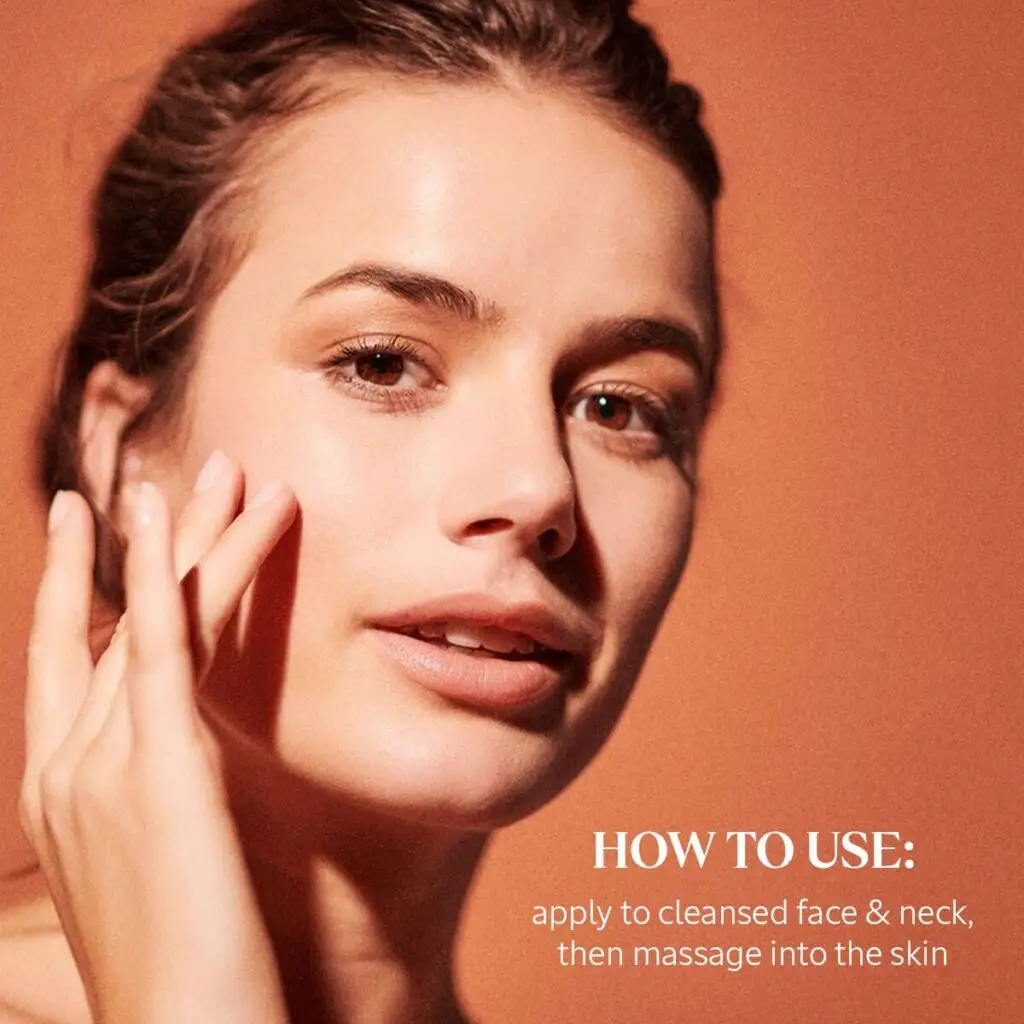 Person with blurred face touching their neck with skincare instructions on a warm background.