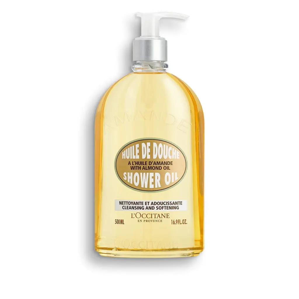 A bottle of L'Occitane's Almond Shower Oil with a golden cap and label, set against a white background.